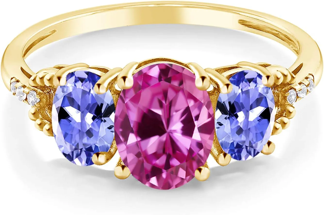 Gem Stone King 10K Yellow Gold 8X6MM Pink Created Sapphire 6X4MM Blue Tanzanite and Diamond Accent 3-Stone Engagement Ring | 2.59 Cttw | 3 Stone Wedding Anniversary Ring For Women
